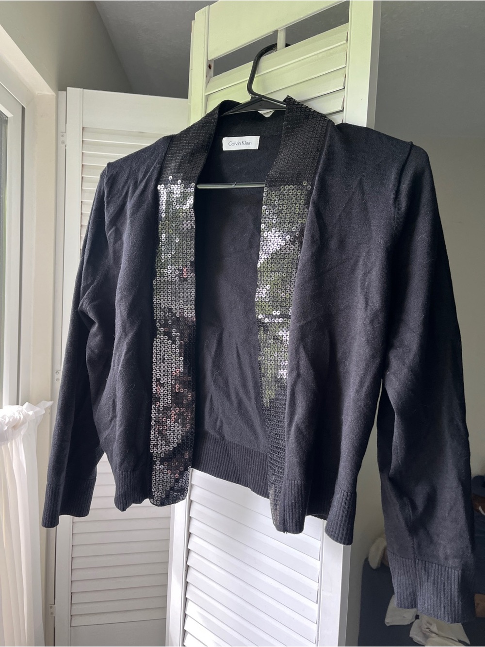 Black cardigan with sequins on collar